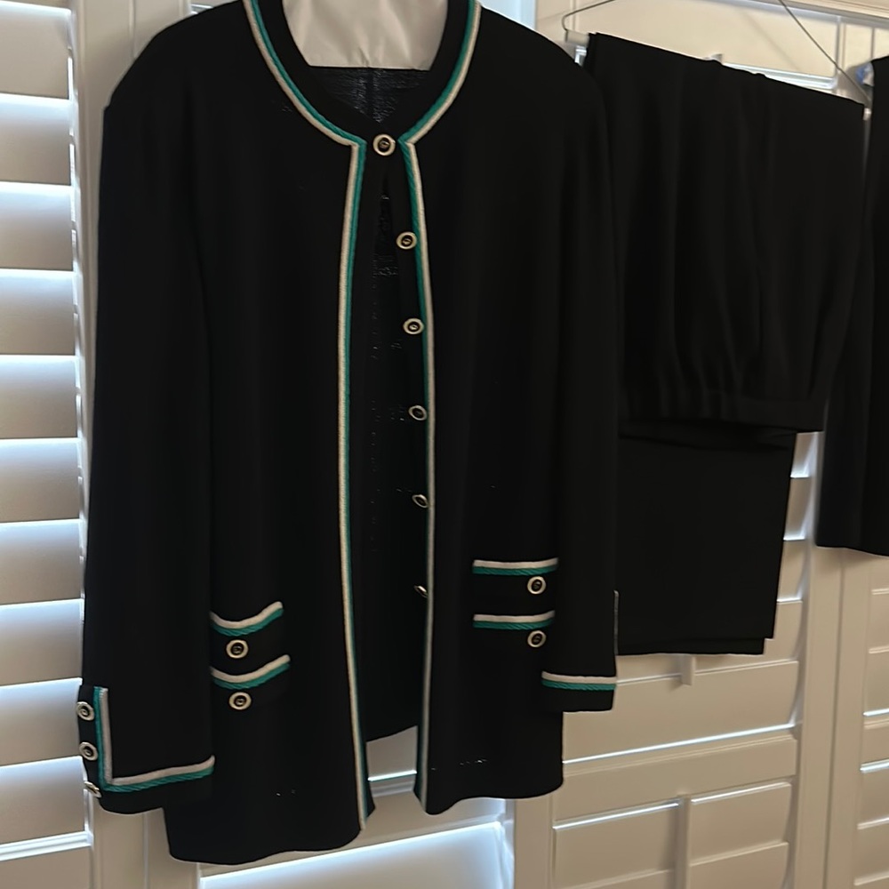 St. John’s collection black suit with green and white trim on jacket and top.